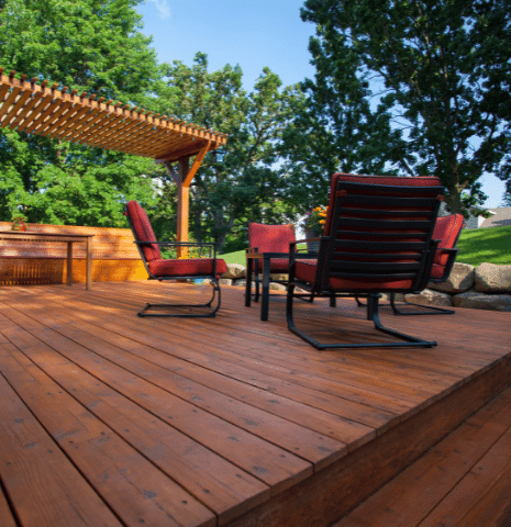 wood deck with table and 4 chairs with mosquito control